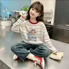 Camiseta de manga larga a rayas de algodón puro para niña, nuevo estilo primavera y otoño 2026, holgada y elegante, camiseta básica versátil para niños