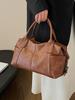 Bolso retro de alta gama de gran capacidad para mujer, nuevo bolso Boston portátil de un solo hombro para otoño e invierno de 2024.
