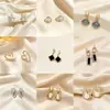 Pendientes de aro minimalistas con un diseño único, pendientes de nicho de plata de ley para mujer, lujo ligero con un toque de alta gama, pendientes de botón de perla, pendientes largos de borla