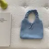 Bolso de punto de lana estilo coreano para otoño e invierno con correa de amarre, adecuado para el trabajo, gran capacidad, nicho, bolso de hombro versátil