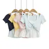 Ropa de mujer transfronteriza al por mayor moda estilo europeo y americano top de dos piezas falso primavera 2026 nuevo camiseta de manga corta con cuello halter