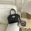 Moda Transfronteriza Versátil Gran Capacidad Primavera 2026 Nuevo Bolso de Hombro Cruzado de Moda con un Toque de Alta Gama y Bolso Cubo de Mano