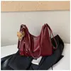 Mochila casual de gran capacidad para mujer 2026 nueva mochila para el trabajo bolsa de hombro cruzada de color liso elegante