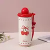 Taza isotérmica portátil de acero inoxidable 316 de alta calidad en stock con tapa de bola redonda, correa y pajita para desplazamientos al aire libre, venta al por mayor