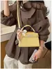 2026 Verão Nova Bolsa Estilo Coreano Texturizada Bolsa Kelly Simples para o Dia a Dia Feminina Bolsa Transversal de Ombro Feminina
