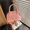 Bolso de mano casual de moda de gran capacidad en color liso con diseño de nicho, bolso de hombro y cruzado para mujer con forma de concha, nuevo y moderno para 2026