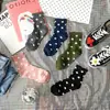 Calcetines de lunares dulces nuevos de otoño e invierno calcetines de lunares para niños estilo académico caricatura japonesa y coreana fabricantes de Liaoyuan al por mayor