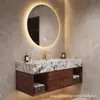 Conjunto de mueble de baño cerámico minimalista sin juntas de una sola pieza con lavabo para lavarse las manos y la cara