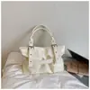 Bolso grande de mujer simple transfronterizo 2026 nuevo bolso de hombro para el trabajo bolso de mano para primavera y verano bolso tote bolso de axila