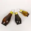 Botella dispensadora de aceites esenciales en forma de calabaza marrón a prueba de luz 50 ml Rodillo Masaje Salón de belleza de alta gama Botella rodante Botella de medicina Botella de vidrio vacía