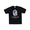 Comercio exterior mayorista transfronterizo estilo japonés moderno estampado de camuflaje cabeza de tiburón cabeza de tigre mono bloques de color luminoso para pareja camiseta holgada morada