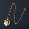 Bestseller transfronterizo acero inoxidable acabado espejo brillante lujo ligero forma de corazón caja de fotos collar que puede contener fotos