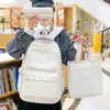 Mochila casual de color sólido simple multicapa de comercio exterior nuevo conjunto de tres piezas para estudiantes de primaria y secundaria