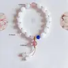 Pulsera al por mayor Suministro de drenaje en vivo Pulsera de Cristal de Fresa Cristal Rosa Pulsera de Lavanda di Leaf Colgante de Cera de Abeja Mujeres