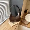 Bolso Simple de Hombro para Axila Estilo Coreano Nuevo Modelo 2026 Bolso Dumpling de Personalidad Nicho para Mujer Bolso de Mano Casual de Moda