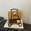 Mochila nueva de dibujos animados, diseño versátil de lunares, bolso bandolera de un solo hombro de moda 2026, estilo nicho para ir al trabajo, colección de otoño para mujer