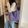 Nova bolsa tote simples de grande capacidade transfronteiriça, bolsa de mão casual e moderna, bolsa de ombro versátil para trabalho e deslocamento