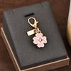 Colgante para llave de coche, bolso de gran sentido, accesorios de color dorado, oso, cereza, trébol de cuatro hojas, mariposa, bolso escolar, joyería al por mayor