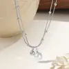 Acero de titanio cadena de cuentas de doble capa colgante de perla cadena para la clavícula collar de titanio para mujer es joyería
