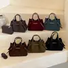 Bolso retro de nicho para mujer, nuevo modelo 2026, bolso cruzado sencillo para el día a día, bolso tipo cubo versátil y moderno para el uso casual