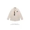 Camisa de manga larga de nicho de dibujos animados azules para hombres y mujeres, ¡primavera y otoño! Nuevo diseño con bordado retro, elegante top tipo cárdigan
