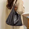 Nuevo Colgante Día de la Mujer Otoño Invierno Coreana Portátil Simple Bolso Tote 2026 Sensación Retro Gran Capacidad Hombro Único Moda