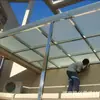 Instalación profesional de fábrica de vidrio de dosel de vidrio de acero inoxidable dosel de vidrio laminado templado dosel de cabeza de puerta construcción