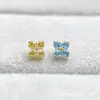 Pendientes de aleación de titanio ASTMF-13 flor de cuatro pétalos de circonita ultra brillante dorados Perforación de labio de circonita con rosca interna de titanio G23