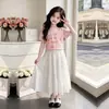 Moda de Verano Casual con Estampado de Flores Top de Manga Corta para Niños Mayores 2026 Nuevo Dulce y Lindo Conjunto de Dos Piezas con Falda Larga