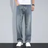 Producto principal de Ropa para Hombre Xintang 2026: pantalones de cuatro estaciones, jeans azul claro, pantalones holgados rectos de pierna ancha para hombre, pantalones de talla grande
