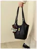 2026 nuevo bolso de mano de estilo retro de alta gama para mujer, versión coreana, bolso de hombro súper popular, bolso simple de axila, bolso tipo cubo versátil, moderno