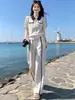 Conjunto Esportivo Casual Color Block para Mulheres Moda Nova Verão 2025 Redutor de Idade Cardigan com Lapela Calça Wide Leg Conjunto de Duas Peças