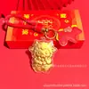Chaveiro fofo estilo chinês de ovelha da sorte em ouro maciço com cordão de couro vermelho, adequado para celebrações de lojas, inaugurações e eventos de seguros, pequenos brindes no atacado