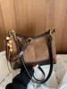 Bolsa de ombro retrô de alta aparência, novo modelo outono 2026, grande capacidade, design de nicho, adequada para trabalho e deslocamento, bolsa de mão para usar sob o braço