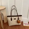 Colección de otoño 2026 transfronteriza: bolso de hombro para mujer moderno y único, con un aspecto sofisticado, diseño versátil y gran capacidad, perfecto para ir al trabajo