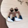 Pendientes de borla con carcasa de madera marrón transfronterizos europeos y americanos, pendientes de estilo vintage Maillard, pendientes de mujer de lujo ligero de alta gama