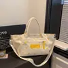 Bolsa de lona transfronteiriça para mulheres, bolsa de grande capacidade para o dia a dia, nova versão coreana de verão, bolsa de mão casual, bolsa de ombro e transversal
