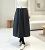 Saia em botão tridimensional estilo Hepburn original! Tecido de lã europeu outono e inverno saia longa elegante