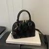 2026 Verano Nuevo de Moda Simple Retro Casual Moderno Alta Calidad Texturizado de un Solo Hombro Cruzado Bolso de Mano Bolso con Forma de Concha