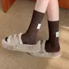 Calcetines de hilo grueso estilo japonés Harajuku para mujer, moda otoño e invierno, tela en el talón con logo, calcetines de longitud media a la pantorrilla, patrón vertical simple, color liso, calcetines de felpa