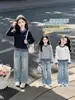 Conjunto de Primavera y Otoño para Niñas 2026 Nuevo Estilo Camiseta Falsa de Dos Piezas Infantil Moda de Niña Conjunto de Dos Piezas de Otoño Tendencia