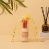 En stock bolsa de organza de color liso con cordón al por mayor bolsa de embalaje de regalo para dulces con cordón Bolsa de malla perlada