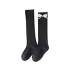 Calcetines de pantorrilla para niñas estilo coreano, estilo ins universitario, calcetines de algodón dulces con lazo de logo personalizado, calcetines de estudiante de tubo medio apilados
