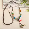 Collar con colgante de campana de mariposa de cerámica de estilo étnico retro para mujer, diseño nuevo y moderno, cadena larga para suéter, accesorios