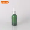 Frascos conta-gotas de vidro verde para óleos essenciais no atacado, frascos dosadores de essência cosmética, frascos conta-gotas com cabeça de borracha dourada, prateada e preta, frascos para loção