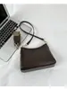 Bolsa de Ombro Vintage Francesa de Nicho Feminina 2026 Nova Versátil Retro para o Trabalho Bolsa Baguete Elegante Bolsa de Ombro