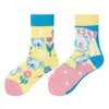 Calcetines originales de moda infantil AB color asimétrico dibujos animados longitud media otoño e invierno caramelos lindos calcetines de algodón para niños y niñas