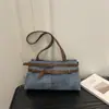 Moda transfronteriza comercio exterior retro simple gran capacidad 2026 nuevo estilo cinturón de cuero moda casual bolso de hombro para mujer