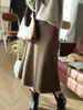Falda midi elegante de acetato y lana estilo francés Yunshuyaxu, de cintura alta, línea A, que cubre la cadera, adelgazante y fluida para el trabajo