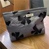 Nicho elegante jacquard nylon bolsa de cosméticos artístico retro elegante flor conveniente clutch bolsa a cuadros transfronteriza